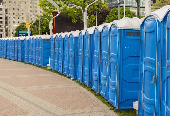 a row of portable restrooms at a fairground, offering visitors a clean and hassle-free experience in Akron